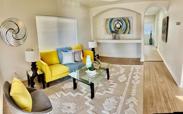 living room with light hardwood / wood-style flooring