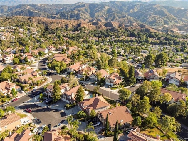 birds eye view of property featuring a mountain view