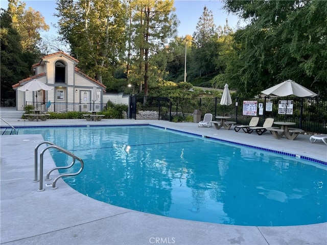 view of swimming pool with a patio area