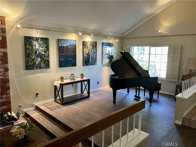 miscellaneous room with hardwood / wood-style flooring, crown molding, and vaulted ceiling