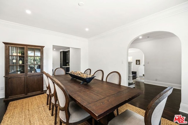 dining room featuring hardwood / wood-style flooring and ornamental molding