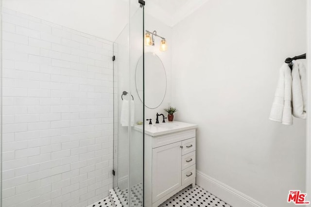 bathroom featuring vanity, crown molding, and an enclosed shower