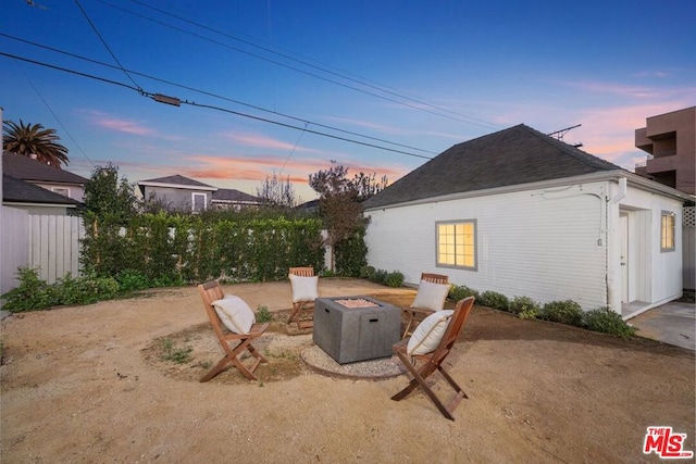 exterior space featuring an outdoor fire pit