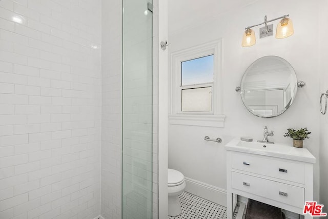 bathroom with crown molding, toilet, walk in shower, and vanity