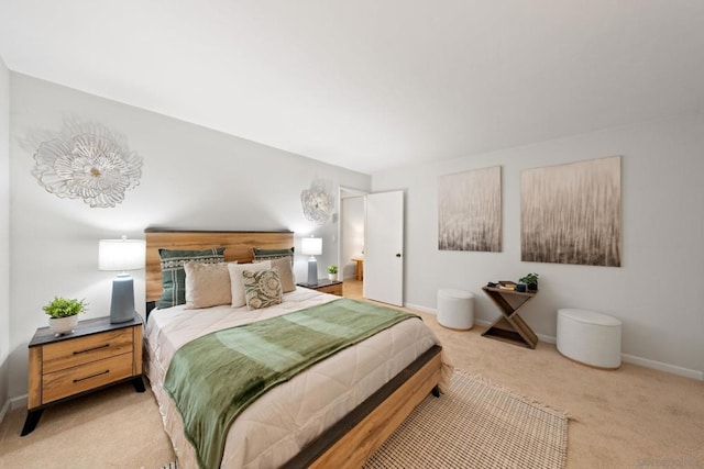 bedroom featuring light carpet