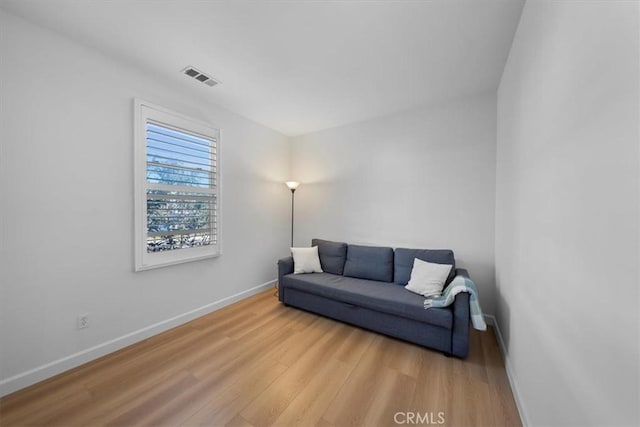 living area with wood-type flooring