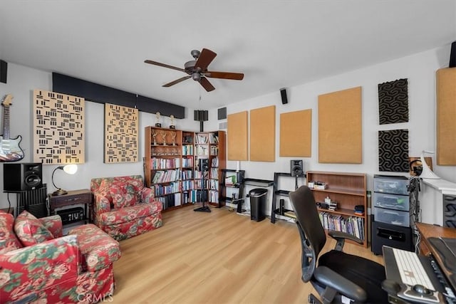 home office with hardwood / wood-style floors and ceiling fan