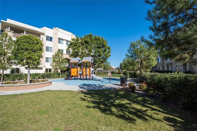 view of pool featuring a lawn and a playground