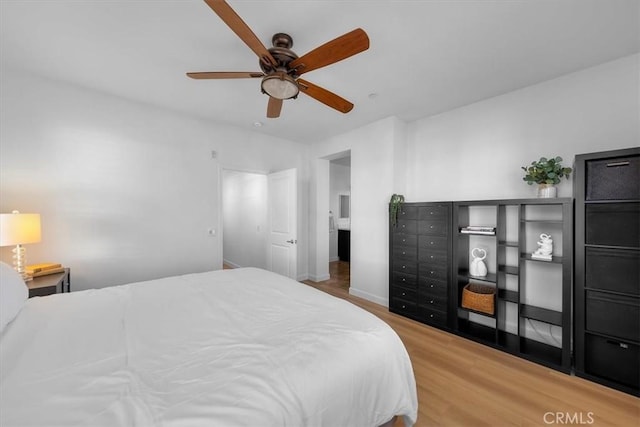 bedroom featuring wood-type flooring and ceiling fan