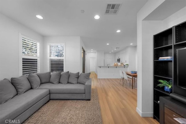 living room with light wood-type flooring