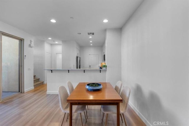 dining room featuring light hardwood / wood-style flooring