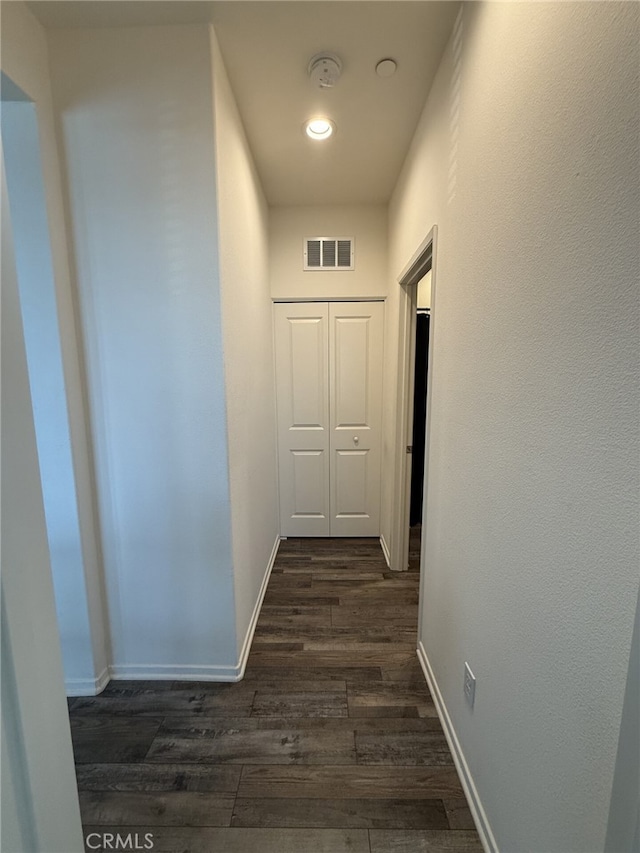 corridor featuring dark hardwood / wood-style flooring