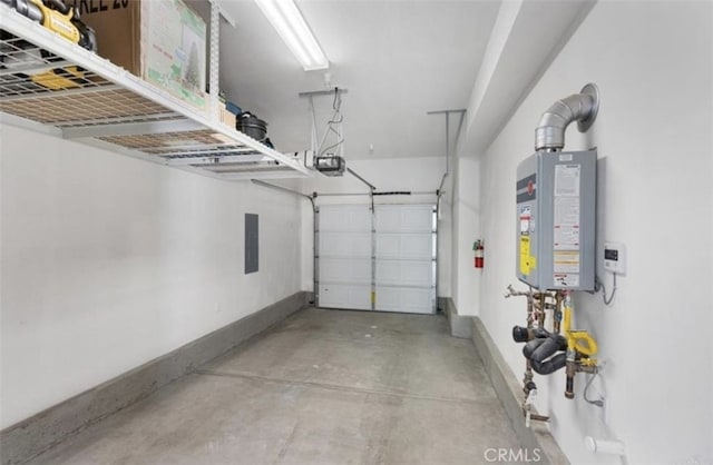 garage with a garage door opener and tankless water heater