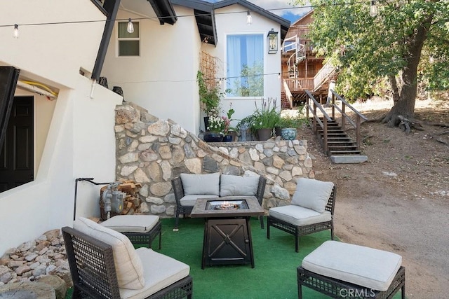 view of patio / terrace with an outdoor fire pit