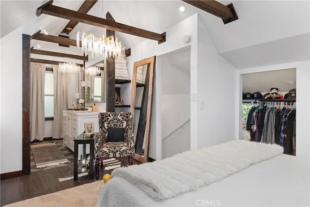 bedroom featuring a closet, vaulted ceiling with beams, and dark hardwood / wood-style flooring