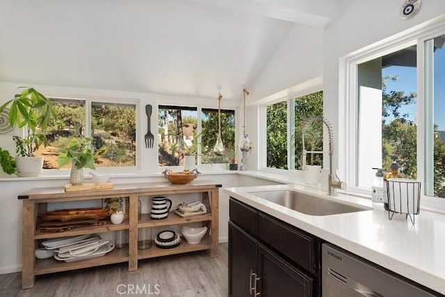 sunroom / solarium featuring sink and lofted ceiling