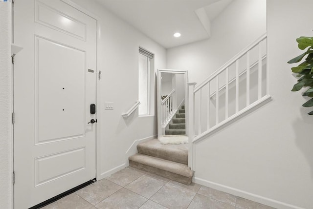 foyer with light tile patterned floors