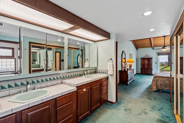 bathroom with vanity, vaulted ceiling with beams, wooden ceiling, and ceiling fan