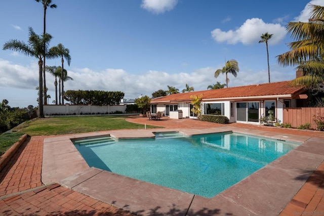 view of pool with a patio area and a lawn