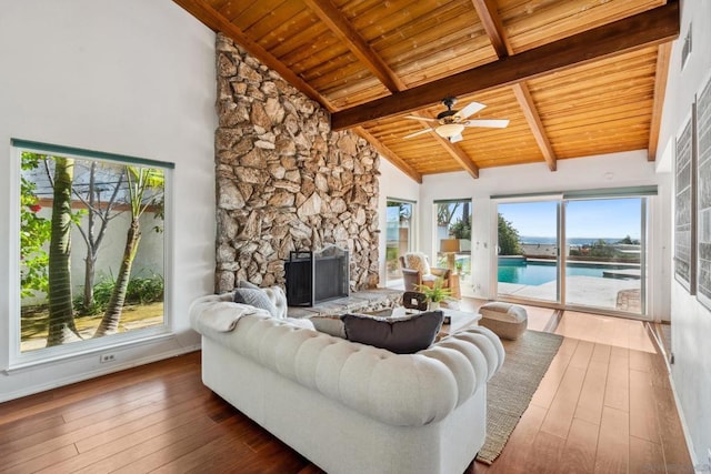 living room with beamed ceiling, high vaulted ceiling, dark hardwood / wood-style floors, and wood ceiling