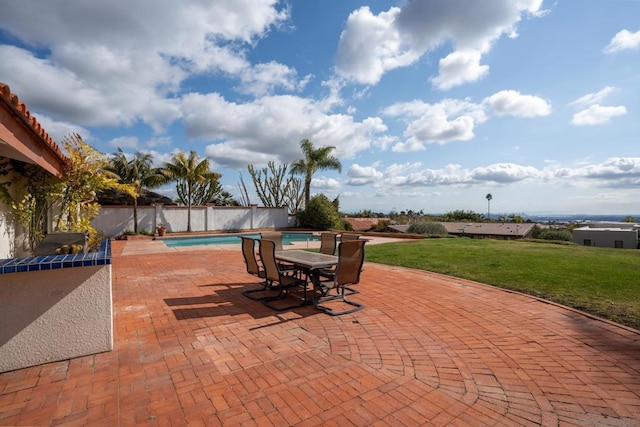 view of patio / terrace featuring a fenced in pool