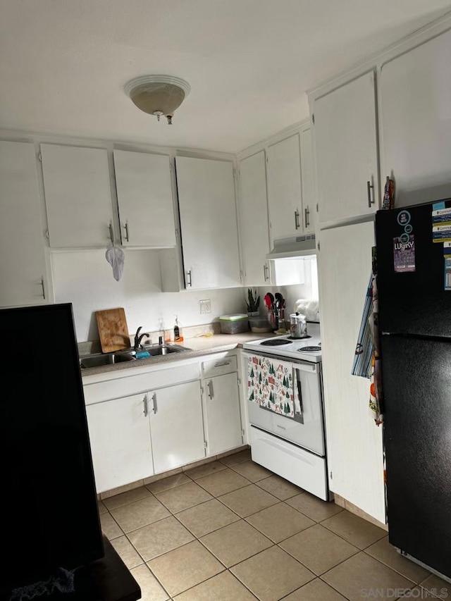 kitchen with white cabinets, white range with electric stovetop, sink, black fridge, and light tile patterned floors