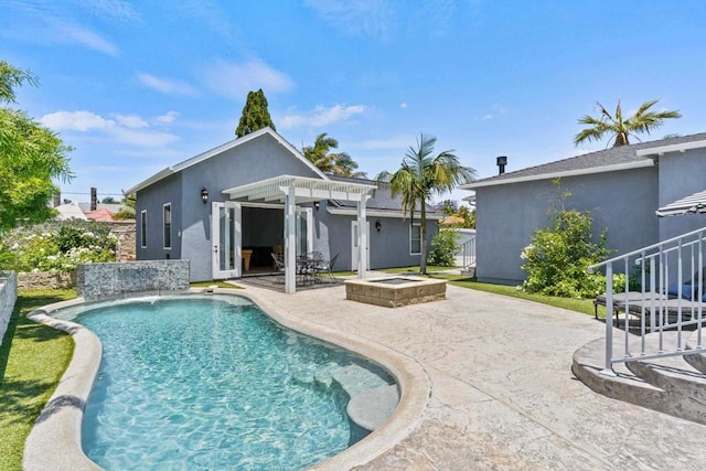 view of pool with a pergola, pool water feature, and a patio