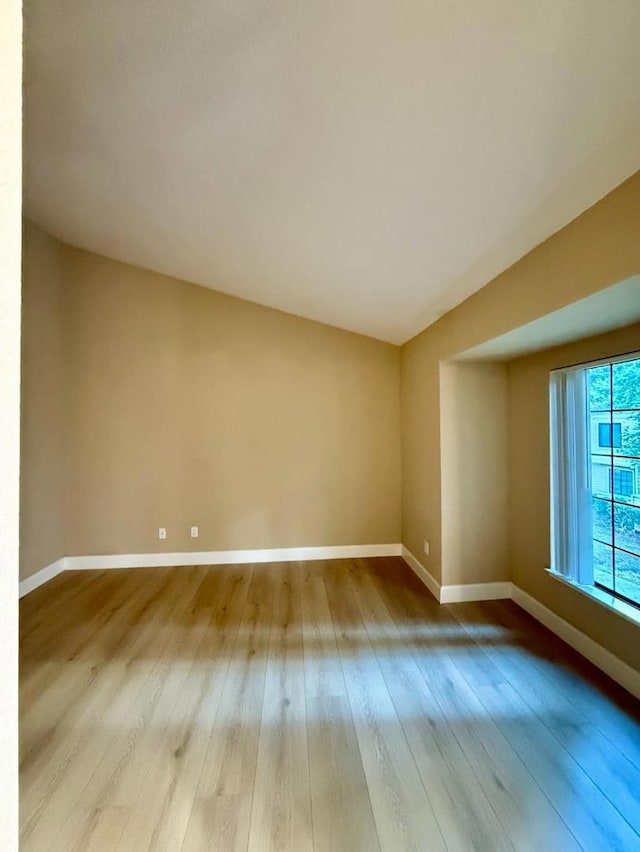 spare room featuring light hardwood / wood-style floors