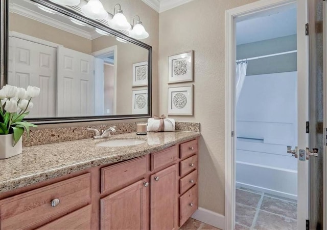 bathroom with vanity, crown molding, and shower / bath combination with curtain