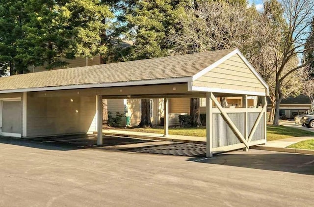 view of outdoor structure with a carport