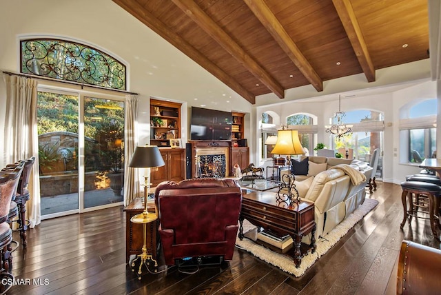 living room with wooden ceiling, high vaulted ceiling, beam ceiling, an inviting chandelier, and dark hardwood / wood-style flooring