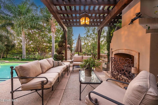 view of patio / terrace with a fenced in pool, an outdoor living space with a fireplace, and a pergola