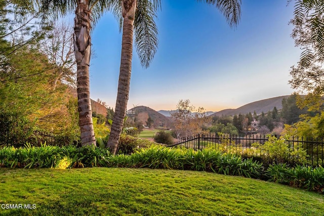 yard at dusk with a mountain view