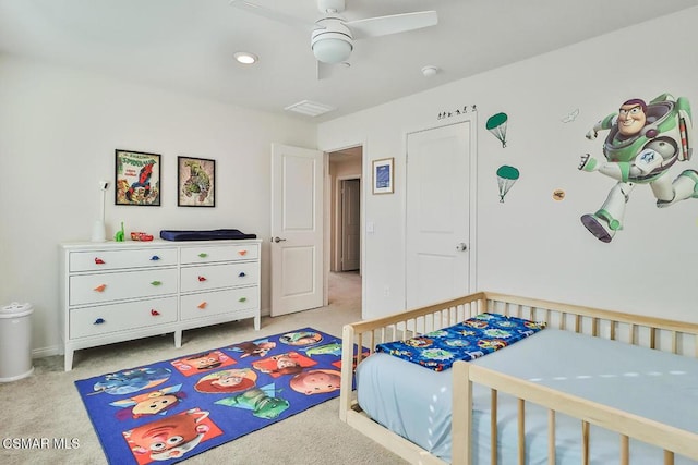 carpeted bedroom with ceiling fan