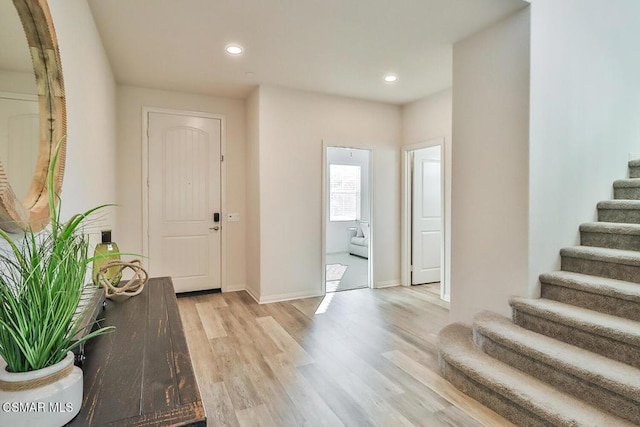 foyer entrance with light wood-type flooring