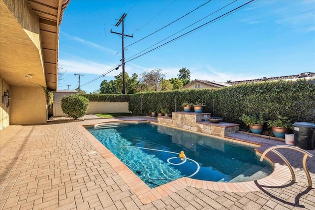 view of pool with a patio area