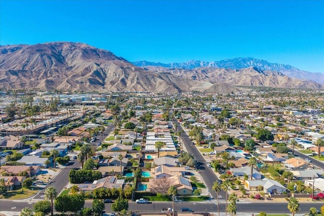 birds eye view of property with a mountain view