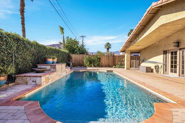 view of pool featuring a patio area