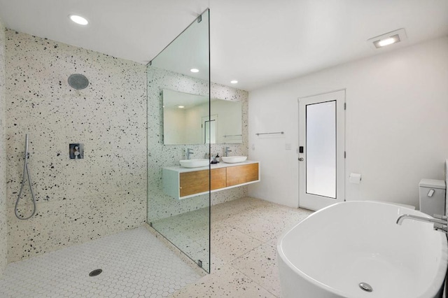 bathroom with vanity and plus walk in shower