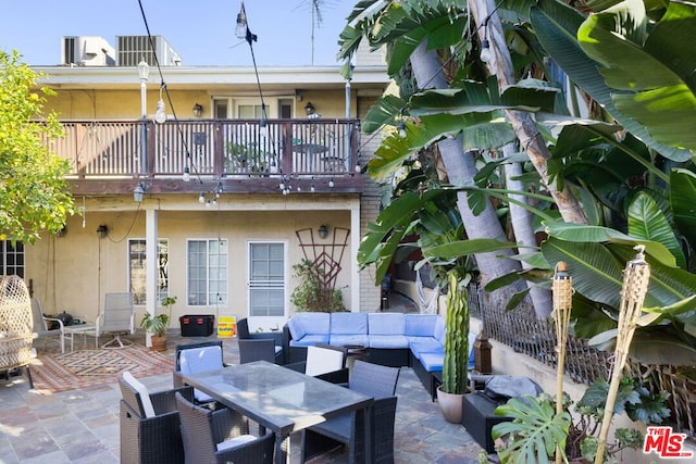 view of patio with a balcony and an outdoor hangout area