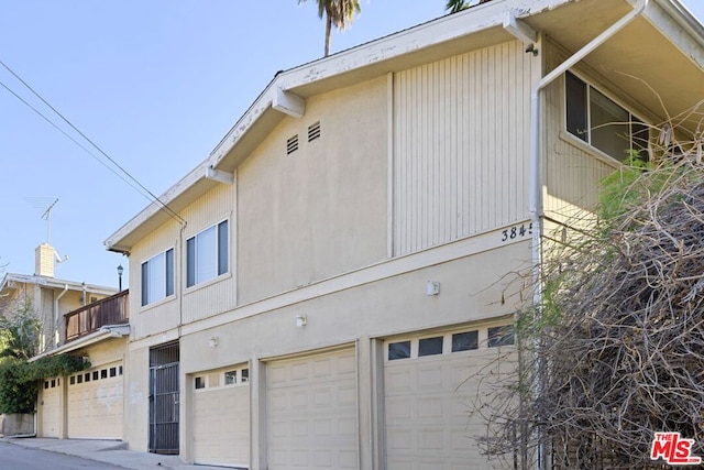 view of side of home with a garage