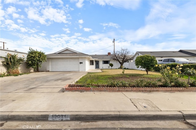 ranch-style house with a garage and a front yard