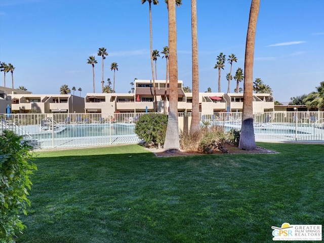 view of yard with a community pool