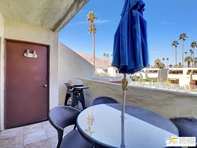 balcony featuring a mountain view