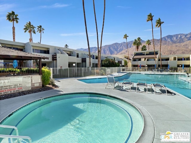 view of swimming pool featuring a mountain view