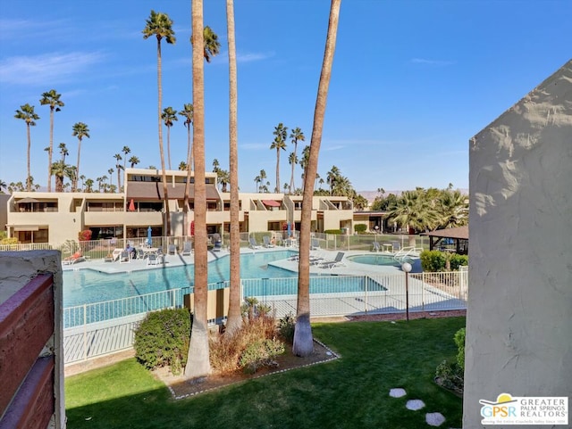 view of pool featuring a patio area and a lawn