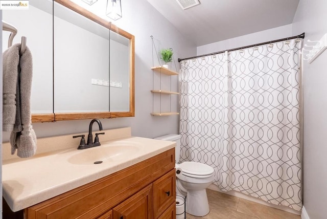 bathroom with vanity, toilet, tile patterned floors, and curtained shower