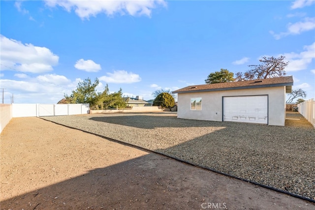 view of yard with a garage