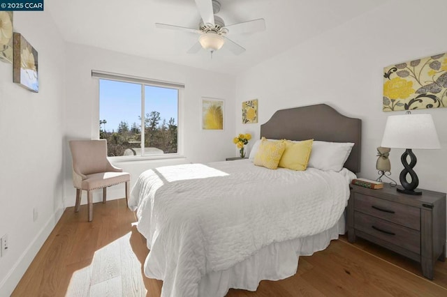 bedroom featuring hardwood / wood-style flooring and ceiling fan