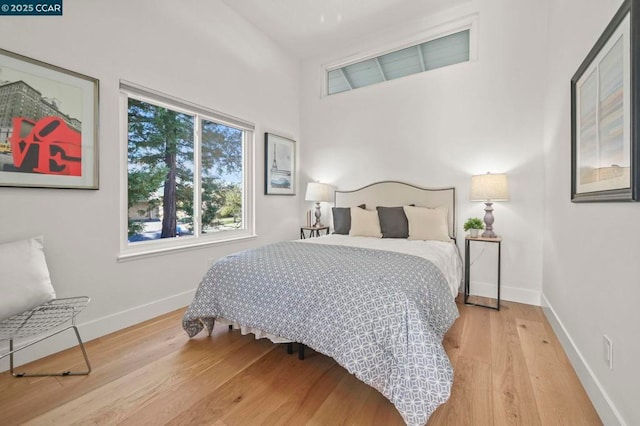 bedroom with wood-type flooring